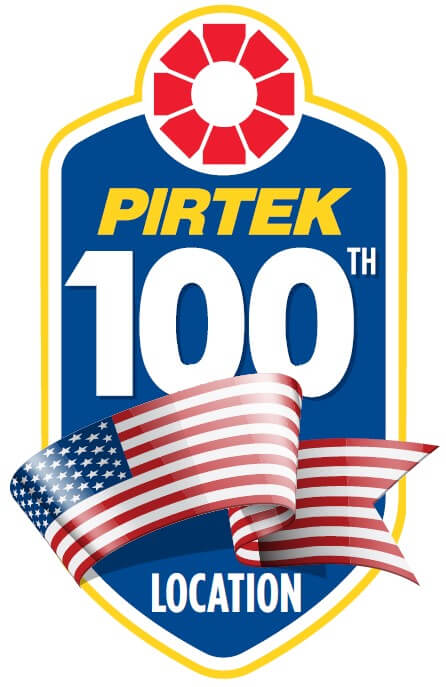 Logo commemorating the 100th location of Pirtek, a B2B franchise, featuring an American flag ribbon.